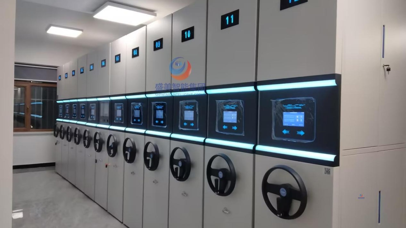 Full deployment of smart compact shelving units across a bright university archive room.